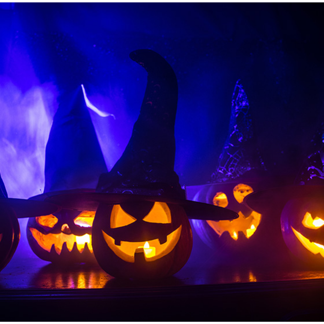 Glowing Jack-o-lanterns on a dark night